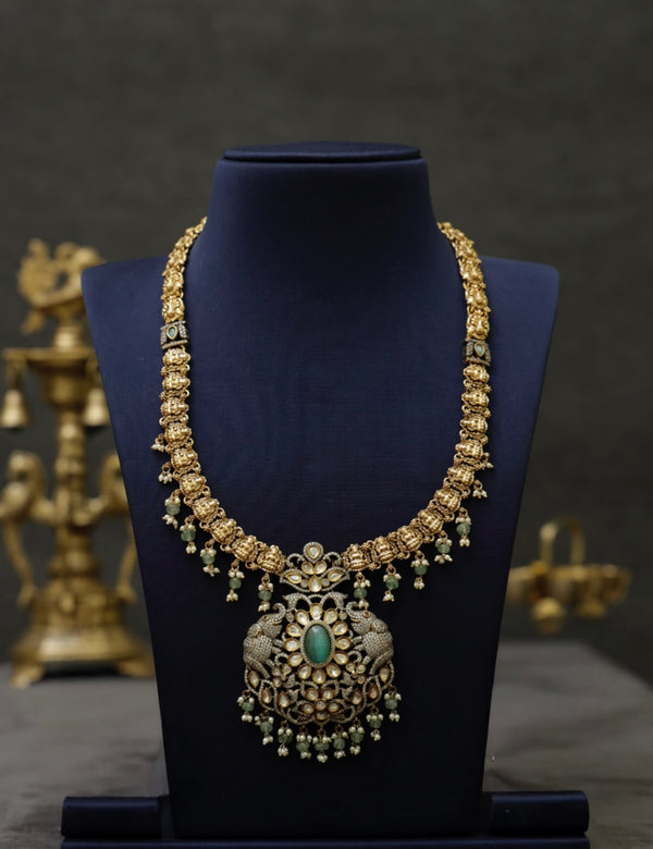 Antique long necklace with victorian detailing and green beads